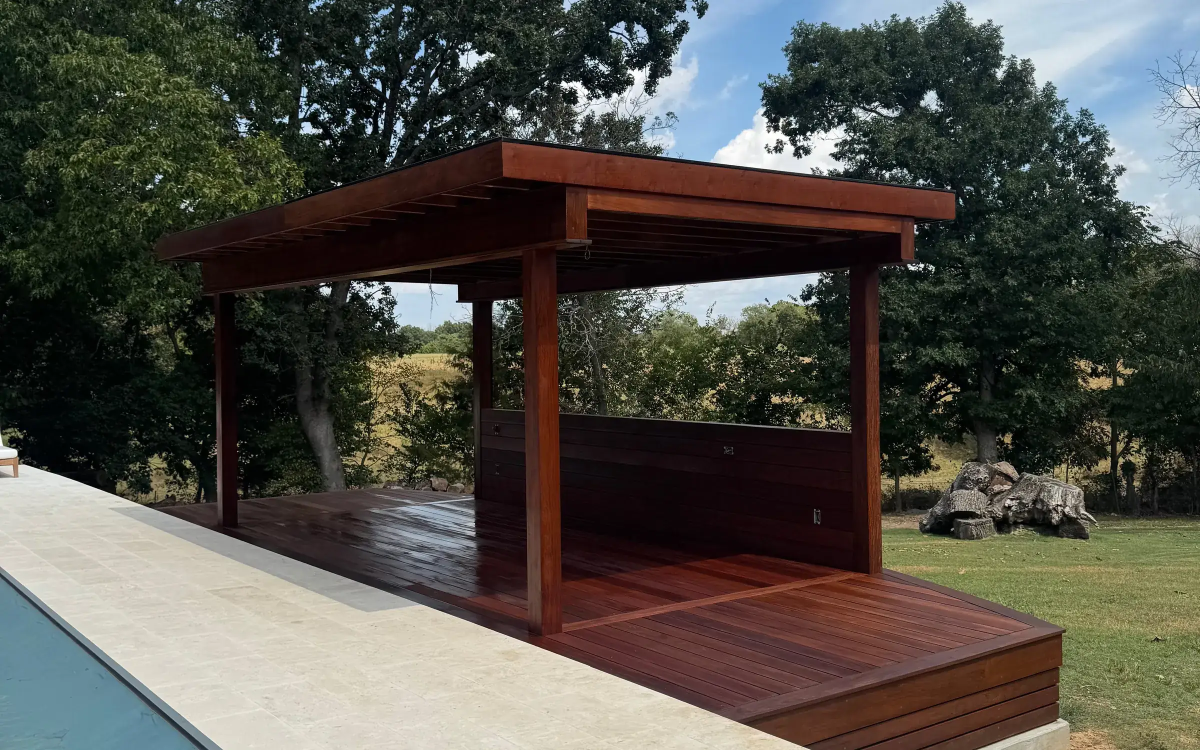 Ipe pergola deck beside a pool