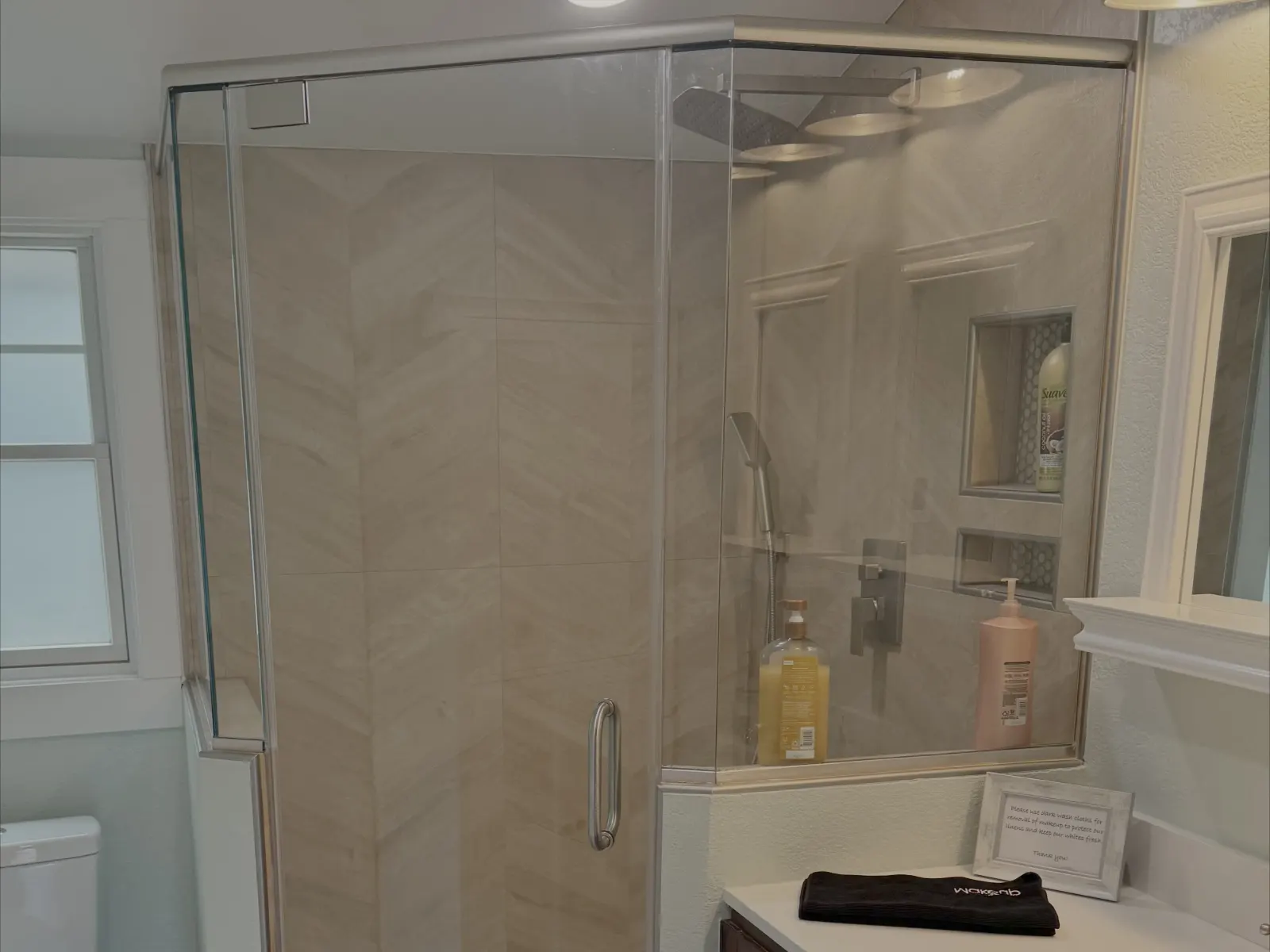 Frameless glass shower in a bathroom remodel
