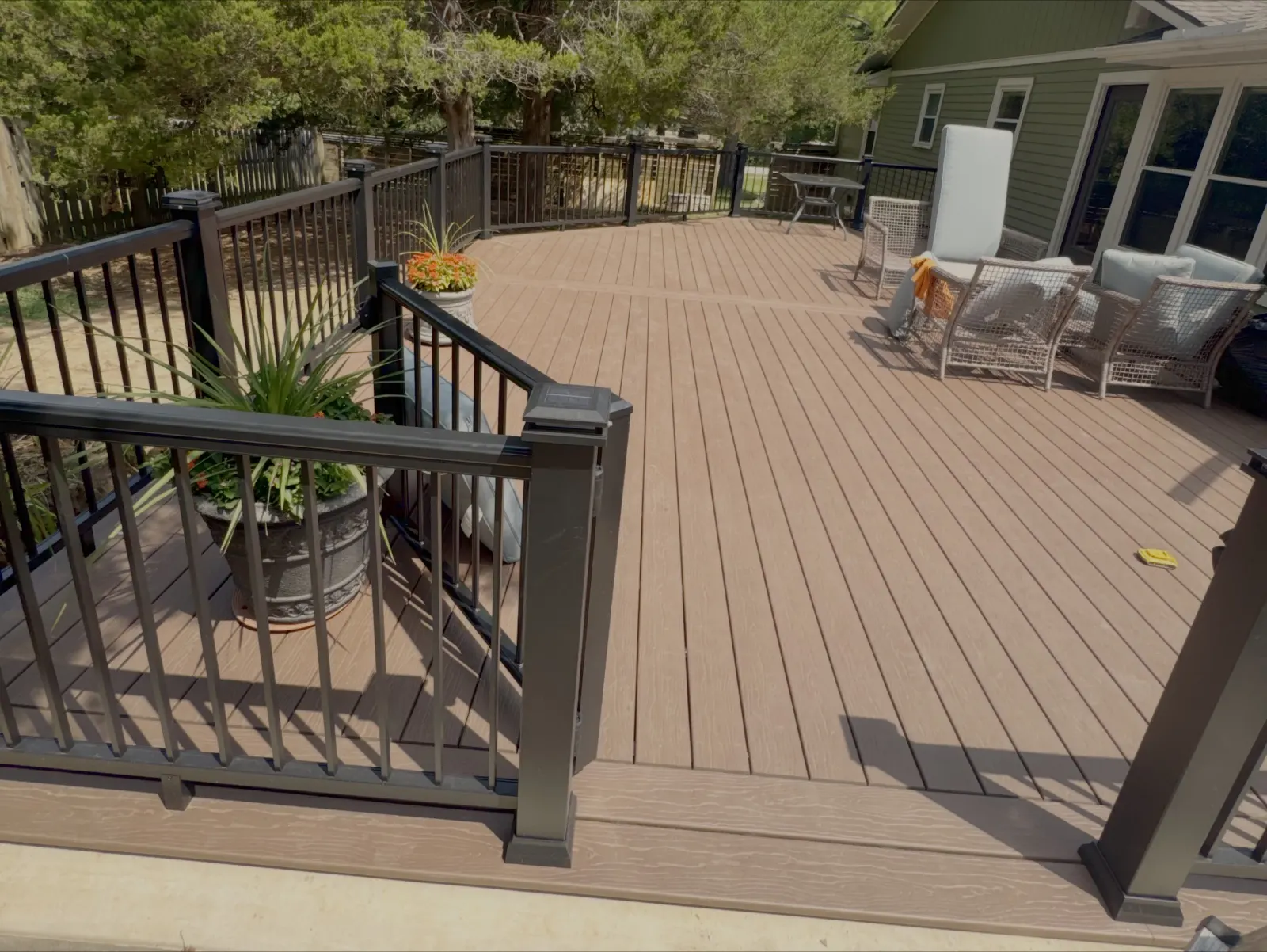 Composite deck with black metal railing