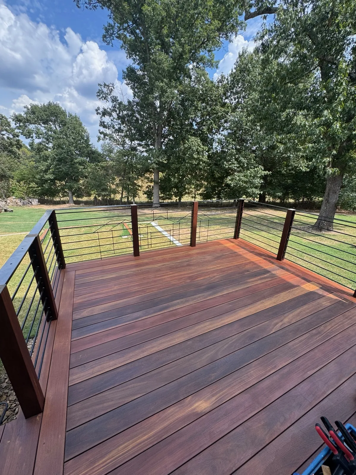Cable rail ipe deck over rolling pasture